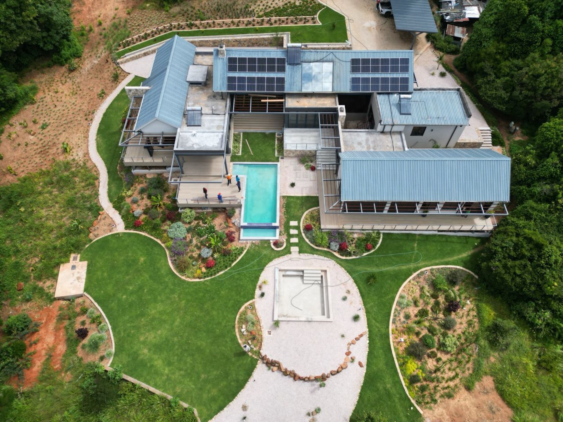 Completed home with pool, aerial view
